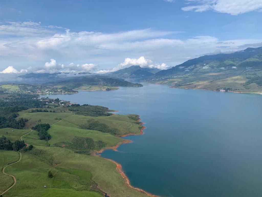 Lake Calima from high above, with green shores and mountains